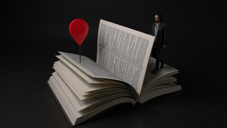 Russell Brand walking through the page of a Bible.