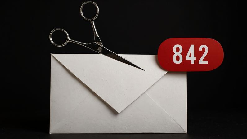 Photo Illustration of an Envelope being cut with scissors