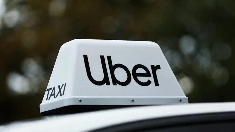 Uber sign is seen on a car in Warsaw, Poland on August 24, 2025 (Photo by Jakub Porzycki/NurPhoto via Getty Images) (NurPhoto/Getty Images)