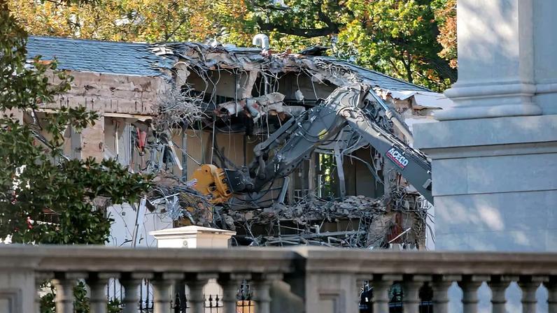 Workers demolish the facade of the East Wing of the White House as part of President Trump's plan to build a ballroom.