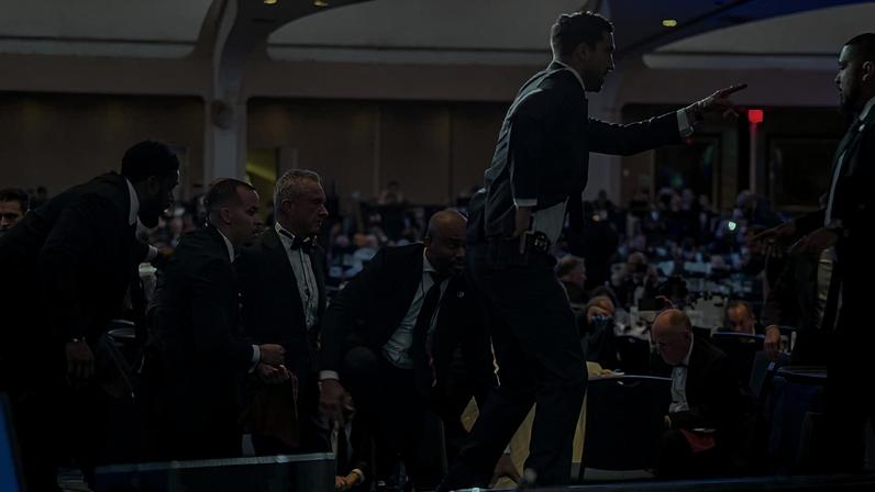 WASHINGTON, DC - APRIL 25: Health and Human Services Secretary Robert F. Kennedy Jr. (3rd-L) is taken out of the ballroom by security agents during a shooting incident at the annual White House Correspondents Association Dinner at the Washington Hilton on April 25, 2026 in Washington, DC. According to reports, President Donald Trump, along with other government officials, were evacuated from the Washington Hilton gun shots. (Photo by Andrew Harnik/Getty Images)