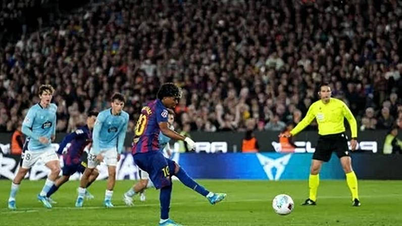 Lamine Yamal of FC Barcelona scores his team's first goal from the penalty spot during the LaLiga EA Sports match between FC Barcelona and RC Celta de Vigo at Spotify Camp Nou on April 22, 2026 in Barcelona, Spain. (Photo by Alex Caparros/Getty Images)