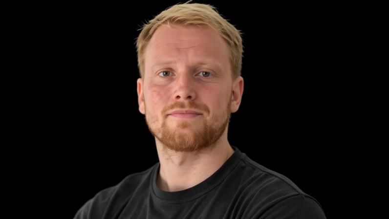 Head shot of Harry Bullmore
