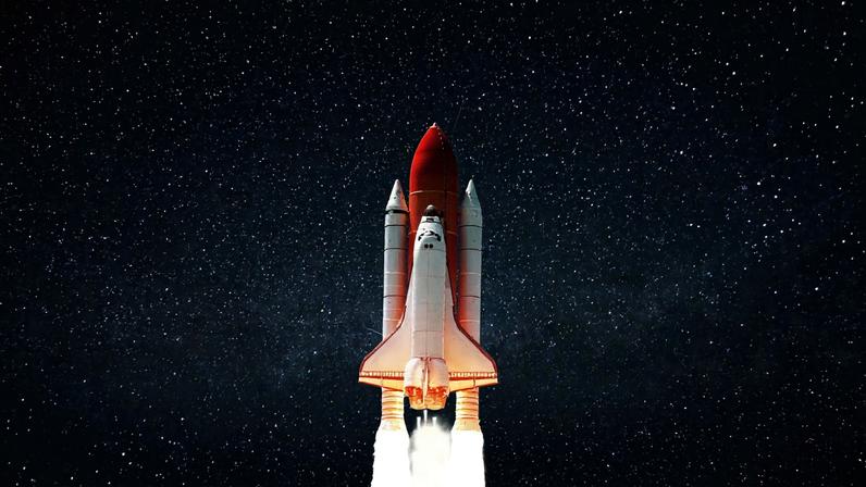 New space shuttle rocket with blast successfully takes off into the night starry sky. Spaceship launched into outer deep...