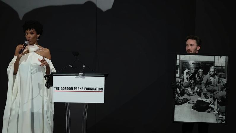 Kimberly Pirtle leads a charity auction at the Gordon Parks Foundation gala in 2025.