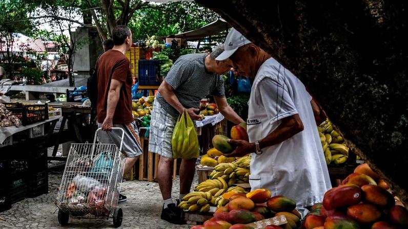 Shoppers buy produce at a market in Rio de Janeiro.
