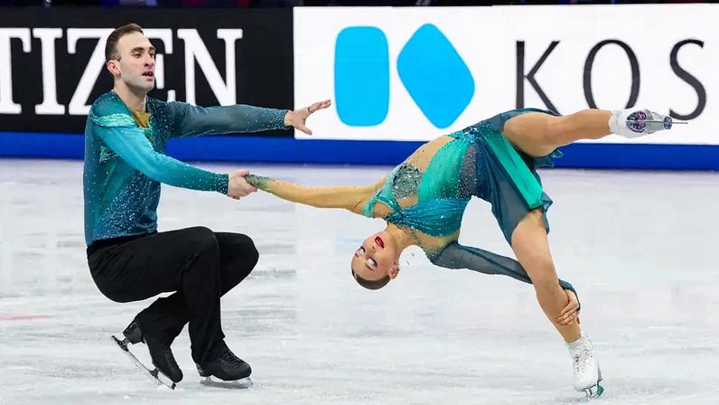 Imagem de um casal de patinadores no gelo.