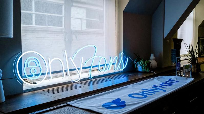 A neon OnlyFans Ltd. sign in the window of the company's offices in London, UK, on Friday, Oct. 4, 2022. OnlyFans executives have mapped out a plan to become more transparent and highlight less-explicit content at a time when the company’s home country is finalizing strict new online safety laws.
