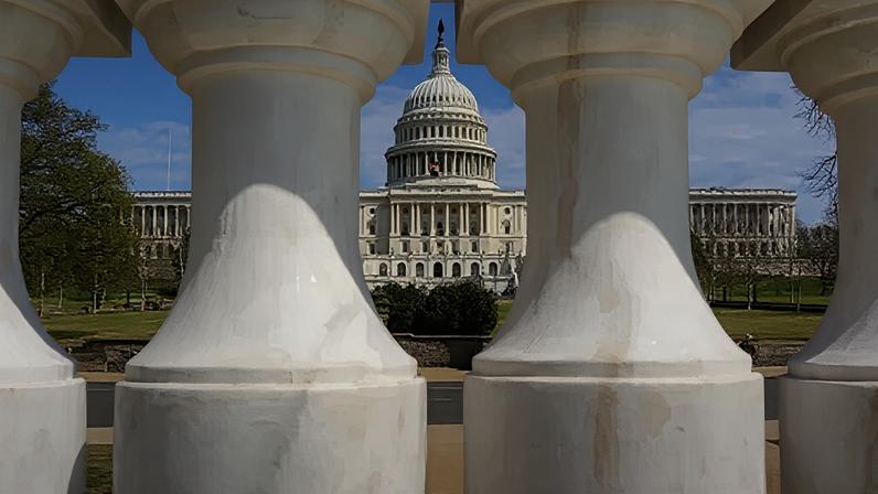 Getty Images The US Capitol is seen between two marble pillars