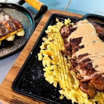 Bife de chorizo servido em cama de batatas e cartola de Thiago Oliveira
