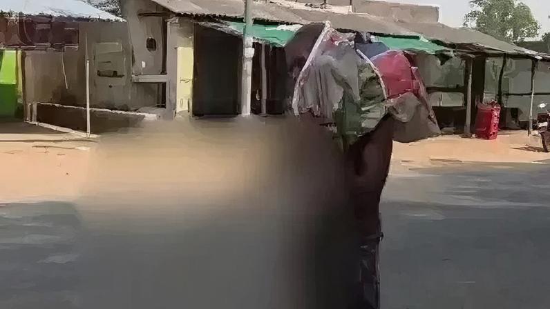 The video of a man carrying the skeletal remains (blurred) of his sister went viral in India this week