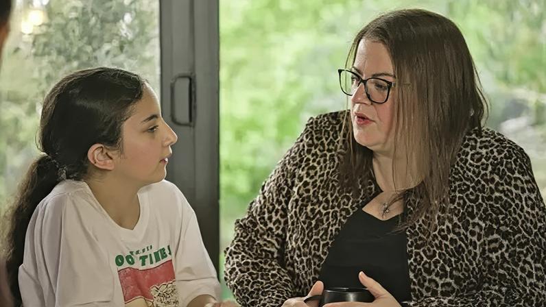 Naomi (r) regularly has to drive her daughter, Riziah (l), more than 30 miles to hospital appointments