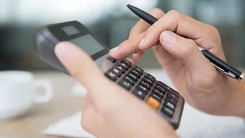 Close-up of male hands using calculator. Unrecognizable accountant holding pen when pushing button on calculator. Finance concept