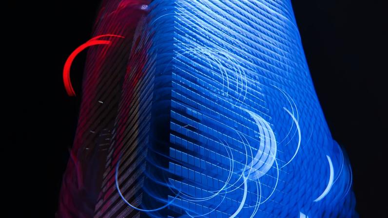 Multiple exposure of brightly lit city, smart city and artificial intelligence concept -