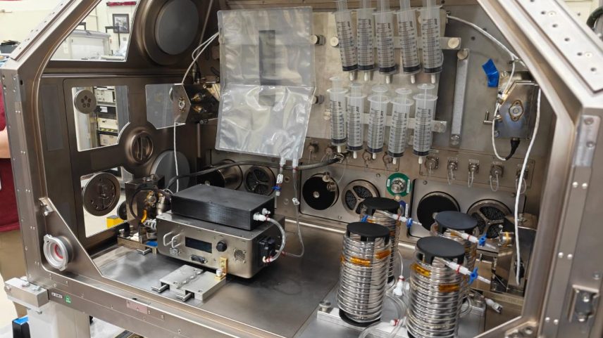 IVGEN Mini hardware is installed in a replica of the International Space Station’s Life Sciences Glovebox at NASA’s Marshall Space Flight Center in Huntsville, Alabama, in November 2025. The system operates by filtering drinking water on the International Space Station to produce medical-grade IV fluid for use when treating inflight medical conditions.