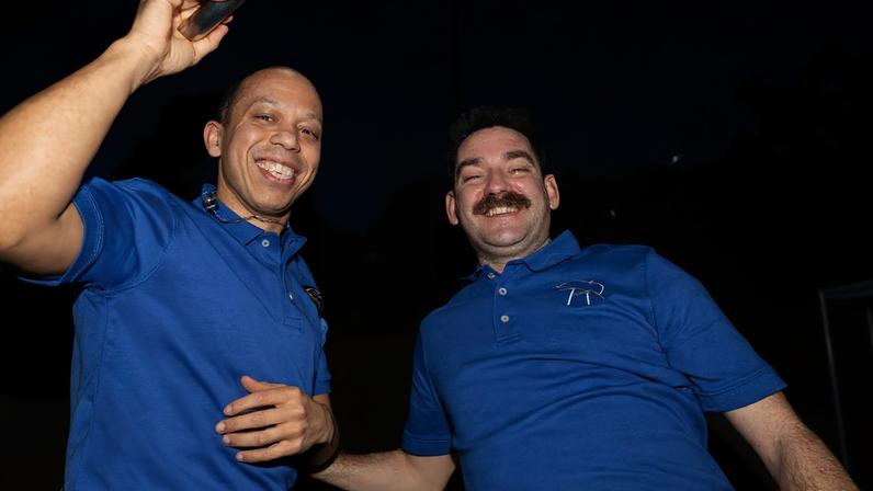 NASA astronauts (from left) Chris Williams and Jack Hathaway, both Expedition 74 flight engineers, pose for a portrait inside the cupola during a break in their procedures as Northrop Grumman's Cygnus XL cargo spacecraft approached the International Space Station. Williams operated the Canadarm2 robotic arm from inside the cupola to capture Cygnus XL, while Hathaway monitored the spacecraft during its approach and rendezvous. Cygnus XL delivered more than 11,000 pounds of new science experiments, lab hardware, and crew supplies for the Expedition 74 crew.