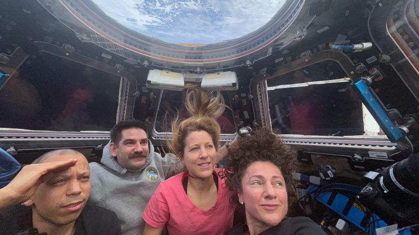 Expedition 74 flight engineers (from left) Chris Williams, Jack Hathaway, Sophie Adenot, and Jessica Meir are inside the International Space Station’s cupola, waiting to observe the plasma trail of the Orion spacecraft—with the Artemis II crew aboard—as it reenters Earth’s atmosphere.