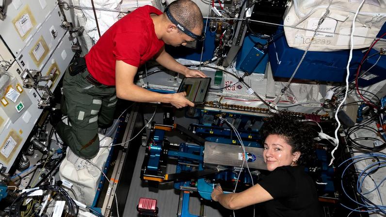 NASA astronauts Chris Williams and Jessica Meir remove and replace components on the European Enhanced Exploration Exercise Device (E4D) to ensure accurate motion, alignment, and long-term system performance. The E4D is being evaluated inside the International Space Station’s Columbus laboratory module for its ability to support crew workouts on missions to the Moon, Mars, and beyond.