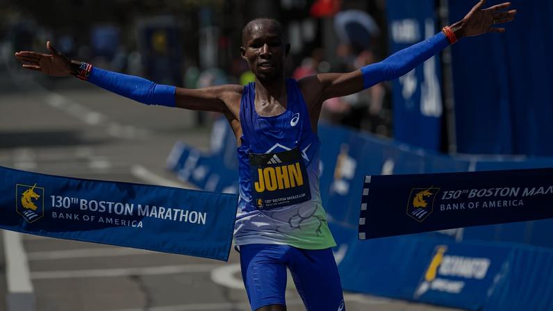 John Korir set a course record with an unofficial time of 2:01:52.