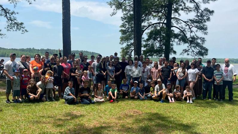 A monthly social gathering of Ukrainian families and volunteers in May 2024 at Noxubee Wildlife Refuge near Starkville, Mississippi.