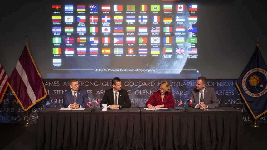 Latvia’s Minister for Education and Science Dace Melbārde, second from right, signs the Artemis Accords, as NASA Administrator Jared Isaacman, second from left, U.S. Under Secretary of State for Economic Affairs Jacob Helberg, left, and chargé d’affaires a.i. at the Embassy of the Republic of Latvia to the United States Jānis Beķeris, right, look on Monday, April 20, 2026, at the Mary W. Jackson NASA Headquarters building in Washington.