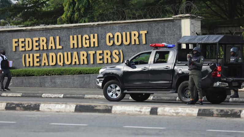 Members of the Nigeria police force are seen outside the Federal High Court.