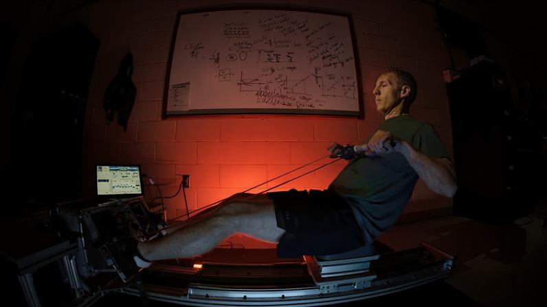 Ryan Schulte, Orion flywheel project manager, demonstrates using the Orion spacecraft's flywheel exercise device at NASA's Johnson Space Center in Houston.