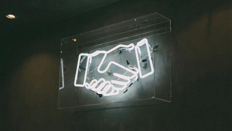Digital handshake sign as, according to SAP, integrating agentic AI into core human capital management (HCM) modules helps target operational bloat and reduce costs.
