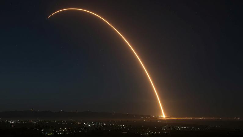 A long-exposure image of a rocket launch