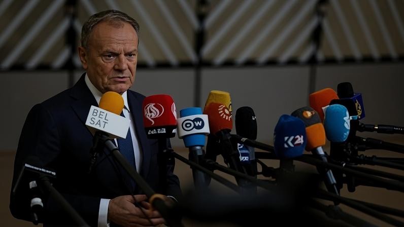 Poland’s Prime Minister Donald Tusk speaks with the media as he arrives for the EU Summit in Brussels, Thursday, Dec. 18, 2025. (AP Photo/Geert Vanden Wijngaert, file)