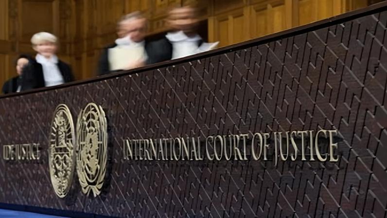 Judges walk to their seats before reading the advisory opinion of the International Court of Justice on what Israel must do to ensure humanitarian aid reaches Palestinians in Gaza and the occupied West Bank, in The Hague, Netherlands, Wednesday, Oct. 22, 2025. (AP Photo/Peter Dejong, file)