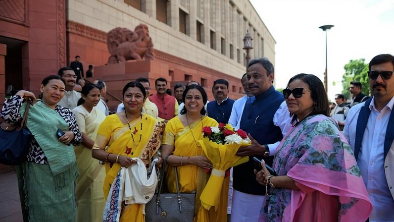 Indian women lawmakers pose outside Parliament House before the start of the debate on a landmark bill to reserve one-third of seats for women, in New Delhi, India, Thursday, April 16, 2026. (AP Photo)