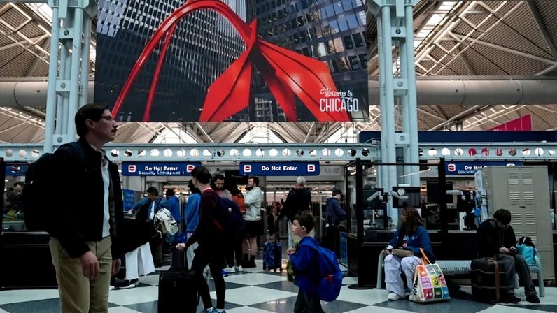 Travelers go through TSA security check at O’Hare International Airport, Saturday, March 21, 2026, in Chicago. (AP Photo/Kiichiro Sat0)