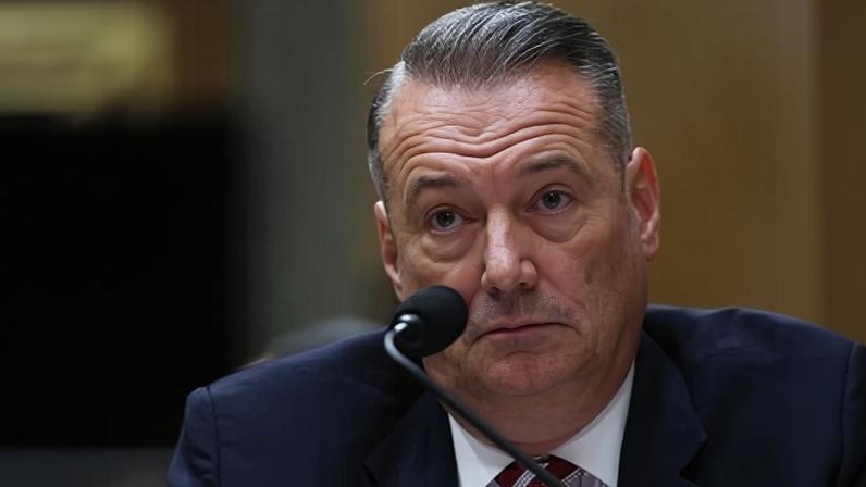 Todd Lyons, senior official performing the duties of the director at U.S. Immigration and Customs Enforcement, listens during a Senate Homeland Committee hearing on Capitol Hill in Washington, Feb. 12, 2026. (AP Photo/Tom Brenner, File)