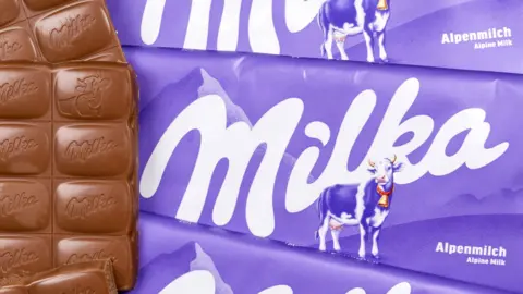 The weight of Milka's Alpenmilch bar shrank from 100g to 90g earning it the title of "rip-off packaging 2025"