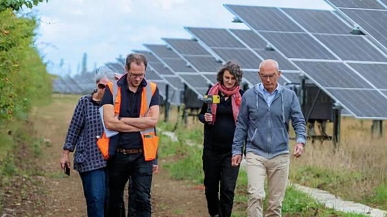 A tour of solar arrays at Ray Valley Solar in Arncott, Oxfordshire, with the farm’s CEO, Barbara Hammond (left). Photograph: Beth McAllister/Low Carbon Hub