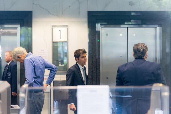 Sam Altman passes by a courthouse security check.
