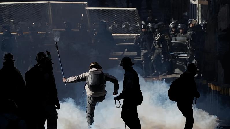Artisanal miners clash with police demanding access to expanded mining areas in La Paz, Bolivia, on 14 May.