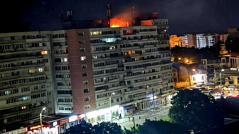 Fire on the roof of an apartment building that was hit by a Russian drone in Galati, Romania.