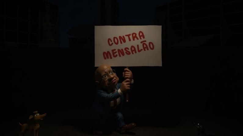 O cartum mostra Joaquim Barbosa caminhando na Praça dos Três Poderes, em Brasília. Ao fundo aparecem o Supremo Tribunal Federal, tendo na frente a Estátua da Justiça, o Congresso Nacional e o Palácio do Planalto. À esquerda, em primeiro plano, um pequeno cachorro comenta: “Joaquim Barbosa quer o apoio de diversos partidos para se candidatar a presidente!” O ex-ministro do STF carrega um cartaz com a inscrição “CONTRA MENSALÃO”. À direita, um cão salsicha lê a placa e responde secamente: “Humm, sem chance!”