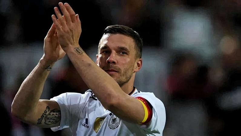Germany's midfielder Lukas Podolski greets fans after a friendly football match between Germany and England on March 22, 2017 in Dortmund, western Germany. It is Lukas Podolski's last match with the German team. (Photo by PATRIK STOLLARZ / AFP)