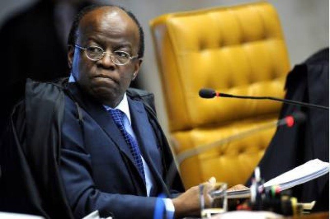 (FILES) In this file photo taken on August 02, 2012, showing Brazilian Supreme Court minister Joaquim Barbosa, taking part in the opening of the trial, known as 'mensalao', in Brasilia, Brazil. The former Supreme Court judge Joaquim Barbosa has a 10 percent of the voter intention for the October national elections even though he hasn't run yet. On April 19, 2018, he registered as a member of the Brazilian Socialist Party (PSB) something that enables him to run for president / AFP / Pedro Ladeira - (crédito: AFP)