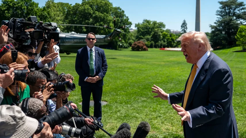 President Donald Trump speaks to reporters before departing for China.