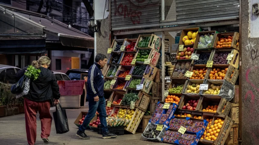 Shoppers browse produce at a grocery store in Buenos Aires.