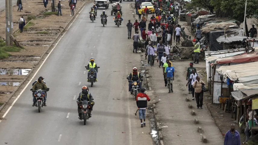 Kenyans walk home after work during a nationwide transport strike over rising fuel prices in Nairobi on May 18.