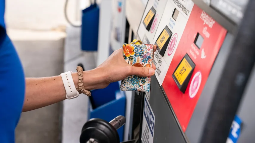 A driver refuels a vehicle with gasoline at a gas station in Seattle, Washington, on April 30.