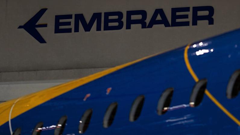 FILE PHOTO: The logo of Brazilian planemaker Embraer SA is seen at the company's headquarters in Sao Jose dos Campos