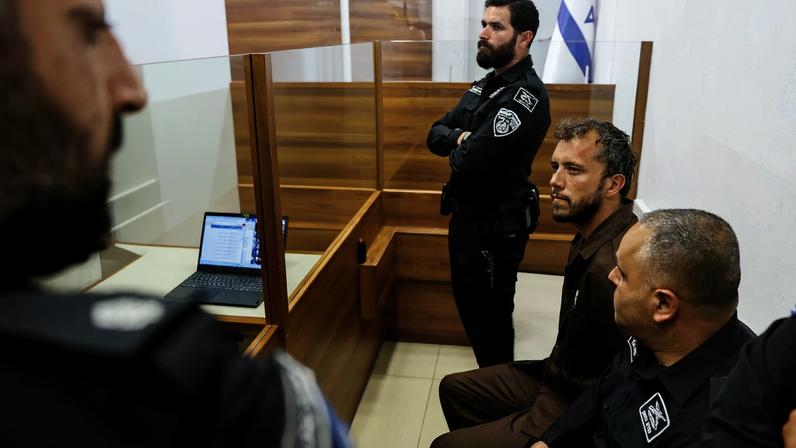 Activist Thiago Avila, a member of the Global Sumud Flotilla detained by Israel, sits at a magistrate's court to attend a detention extension hearing in Ashkelon, southern Israel, May 3, 2026. REUTERS/Amir Cohen