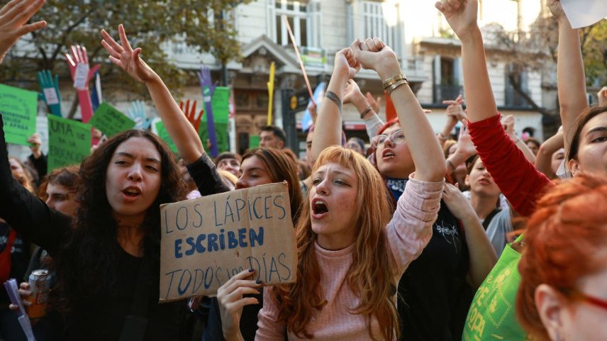 A demonstrator holds a sign that reads "The pencils write every day", as Argentine university workers and students attend a march to protest against public university defunding, in Buenos Aires, Argentina May 12, 2026. REUTERS/Cristina Sille
