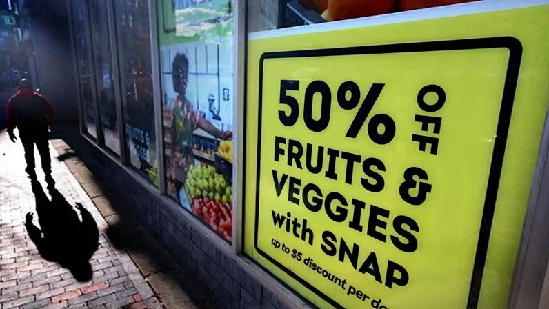 Snap benefits advertised in the window of a store.
